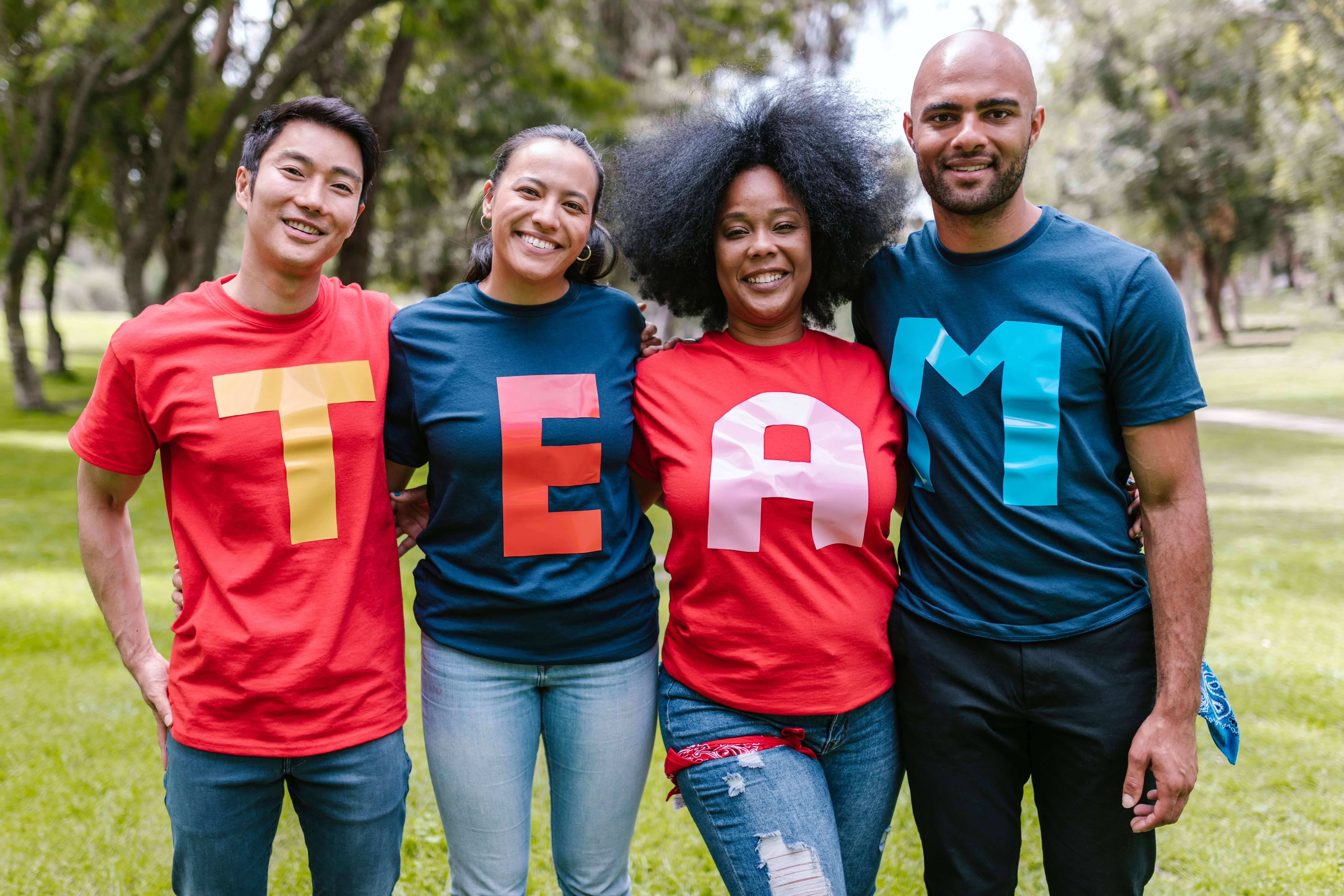 group of colleagues with the words team on their shirts