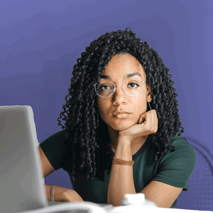 woman with laptop looking at the camera