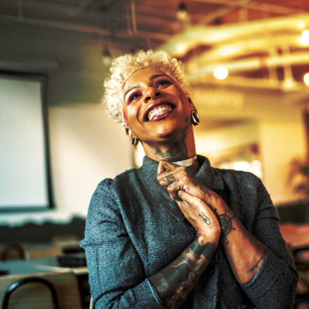 Businesswoman applauding at business meeting