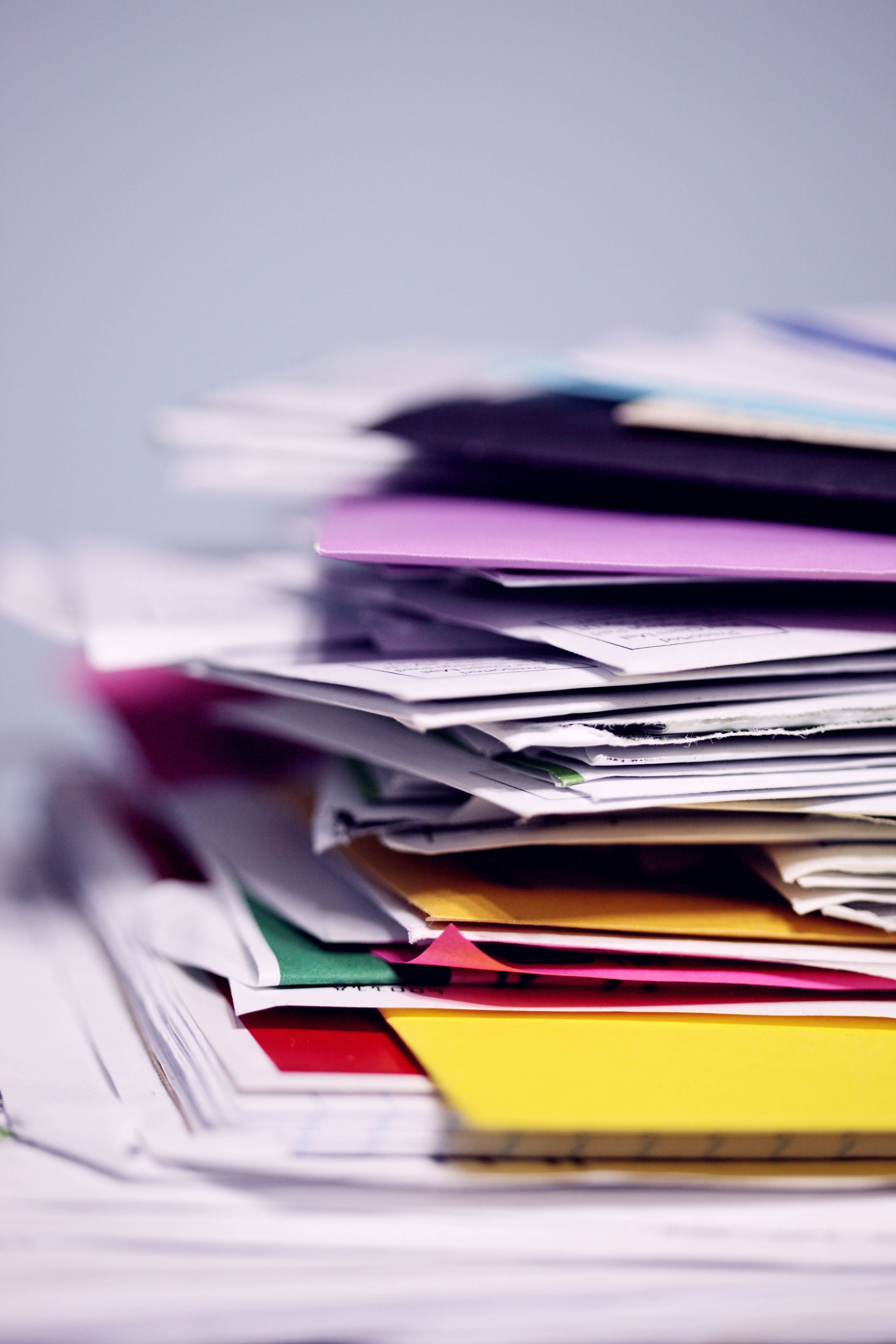 A messy pile of papers on a desk