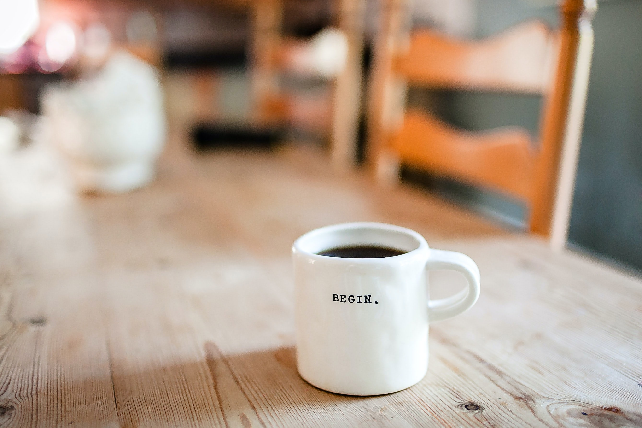 A cup of coffee on a wooden table