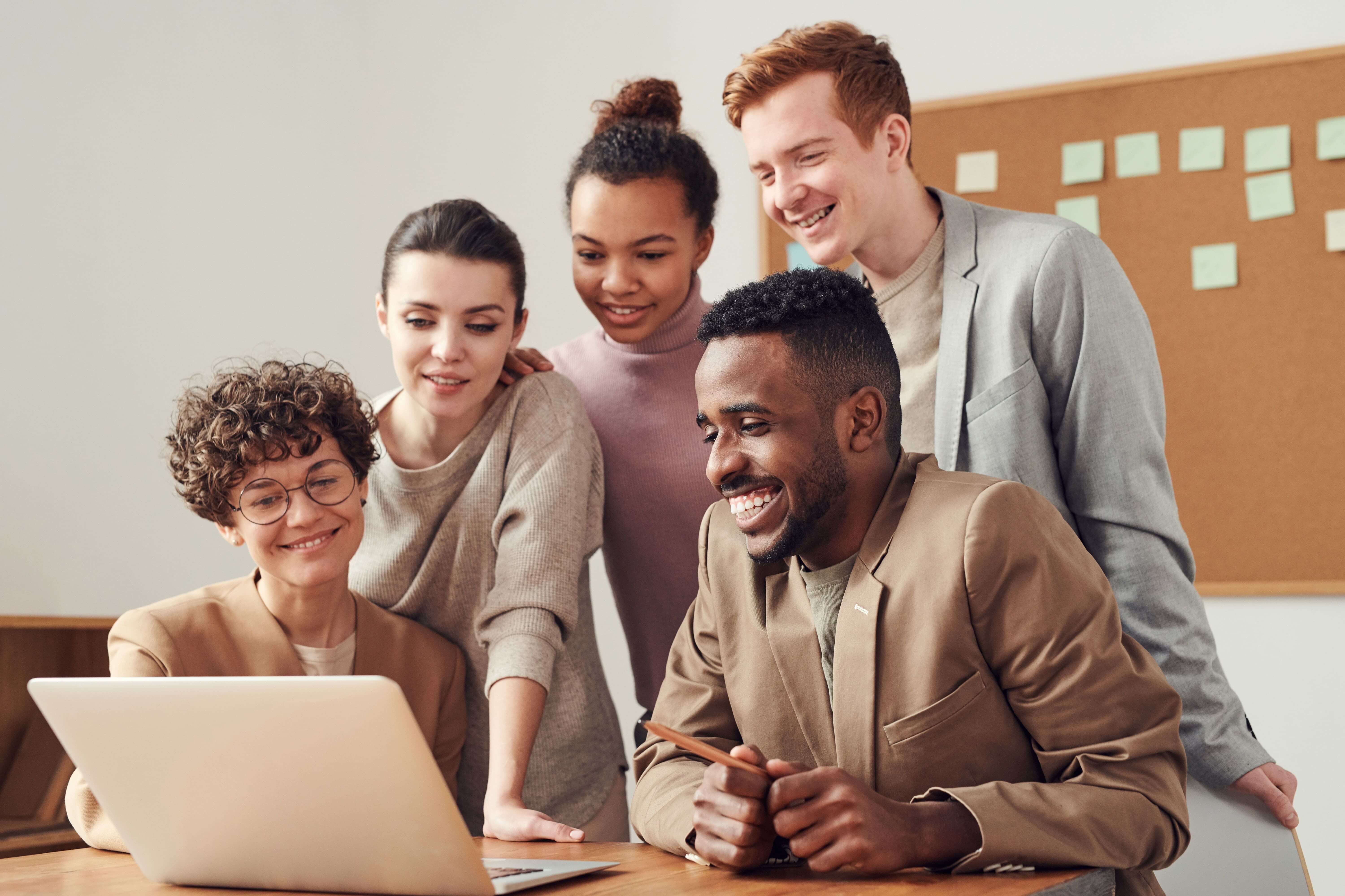 Colleagues looking at a laptop