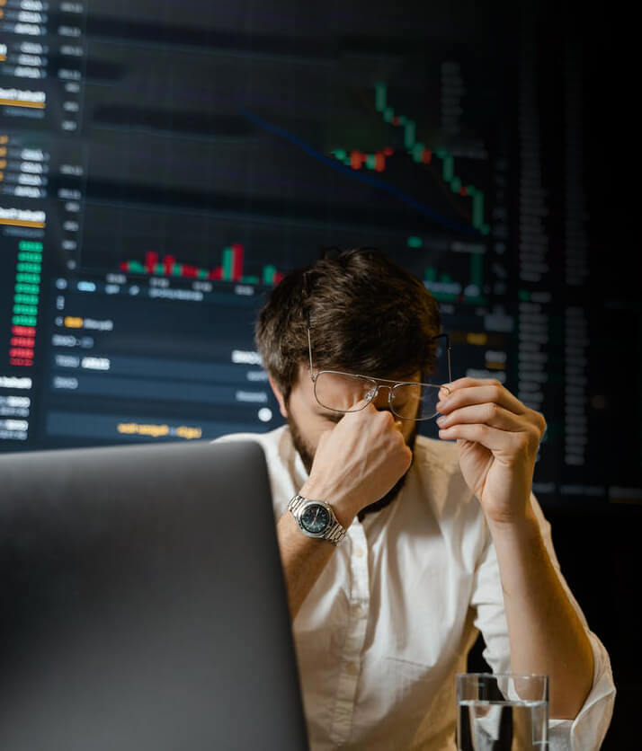 A frustrated employee in front of a computer