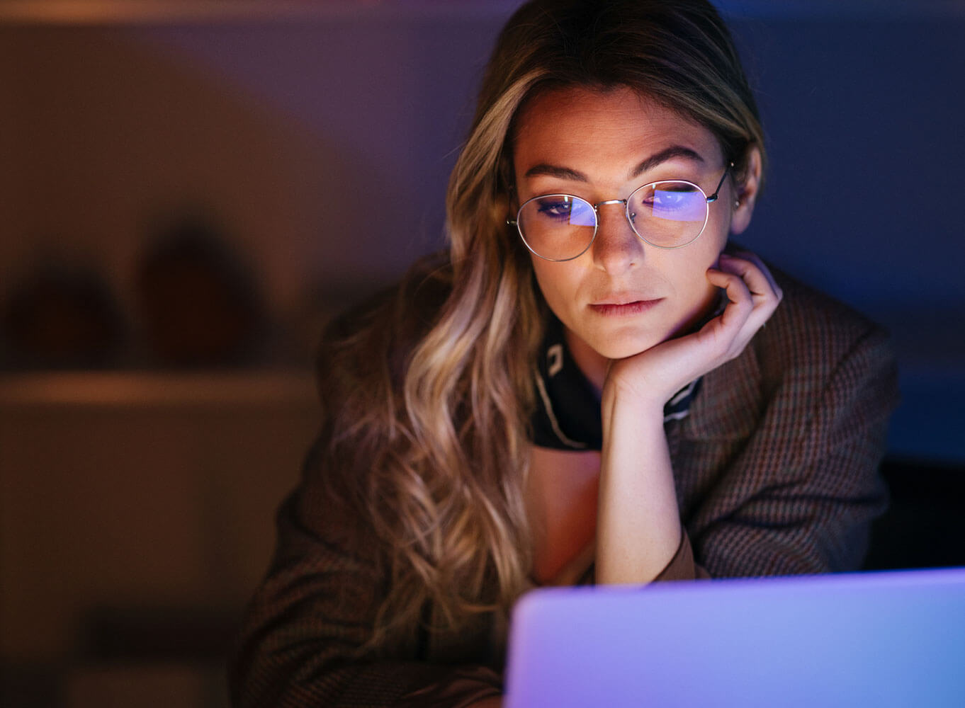 Beautiful Businesswoman Working Late in the Office Using her Laptop