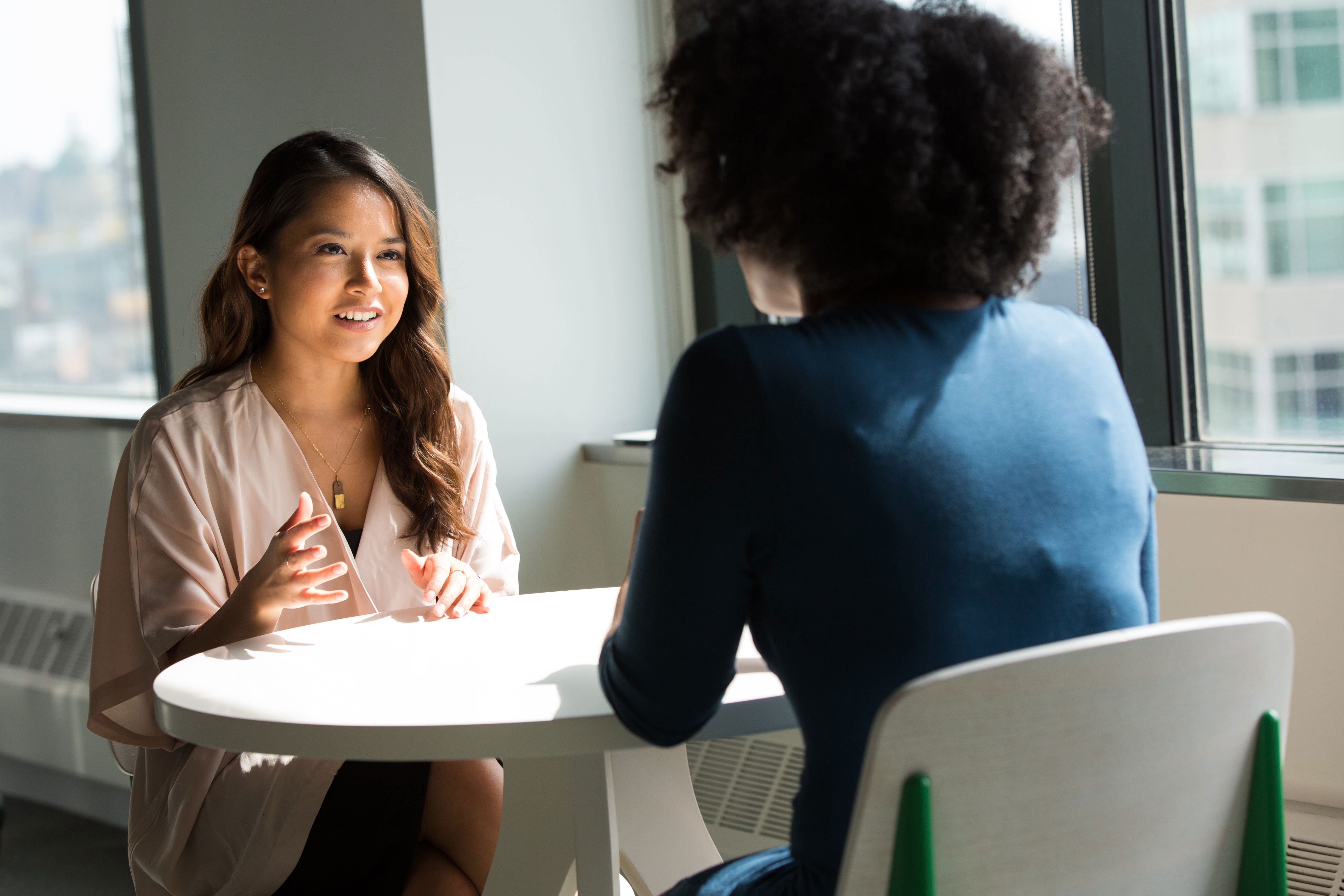 two woman having a meeting