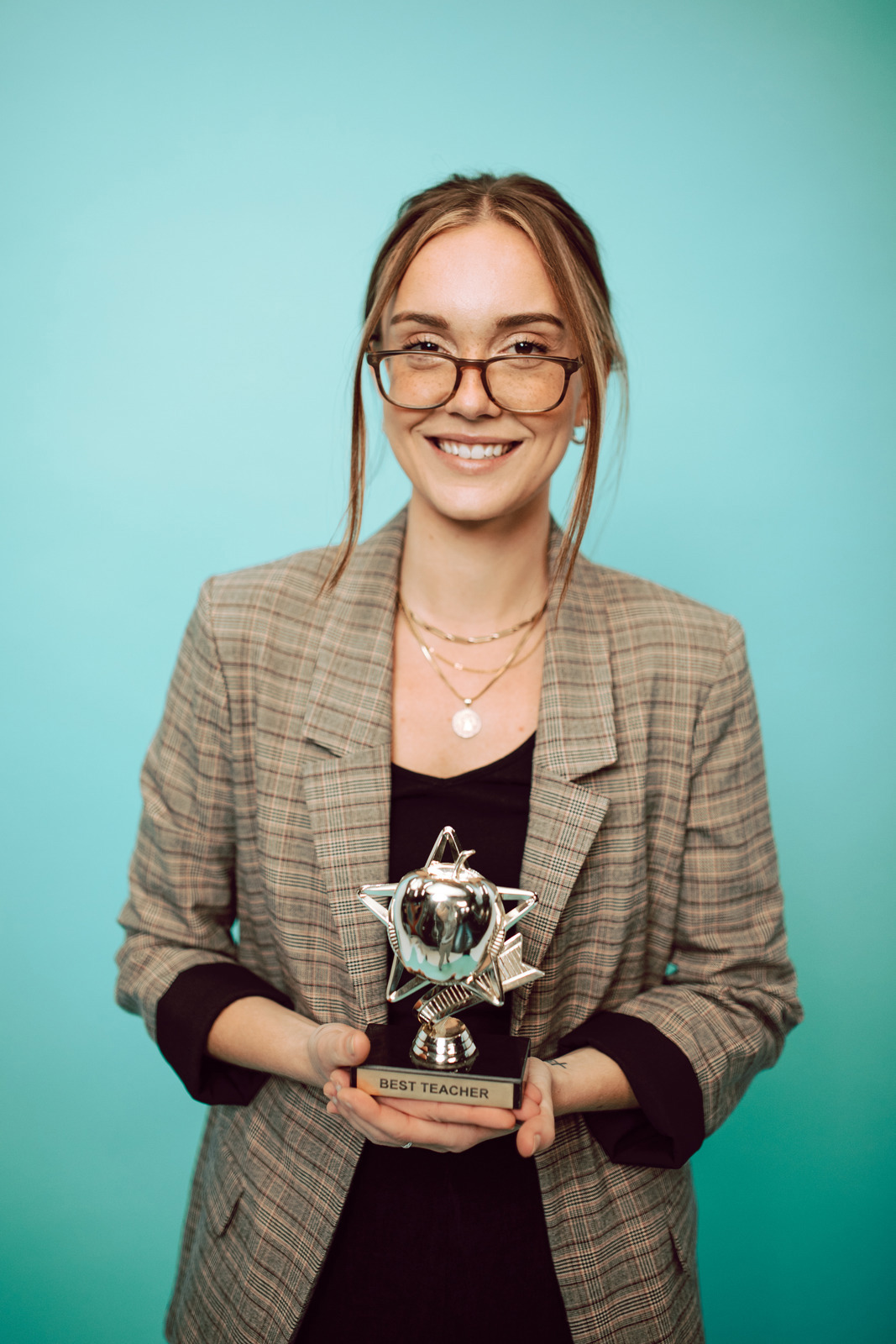 woman holding award