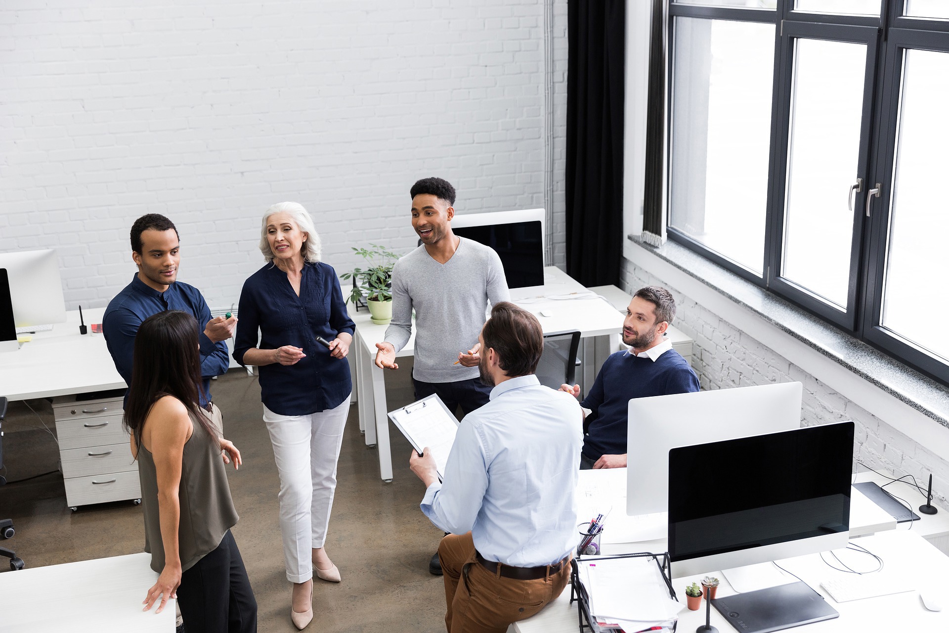 Top view of modern staff meeting in a bright setting